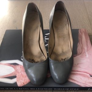 Grey Christian Louboutin pumps, worn